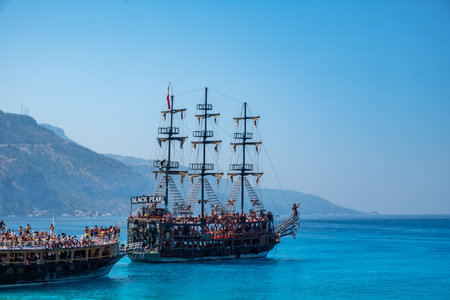 July 19, 2019. Oludeniz, Turkey. Blue Lagoon. Pirate ship near the shore. People relax on the ship