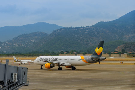 July 19, 2019. Dalaman, Turkey. Thomas Cook Airlines plane on taxiway strip.のeditorial素材
