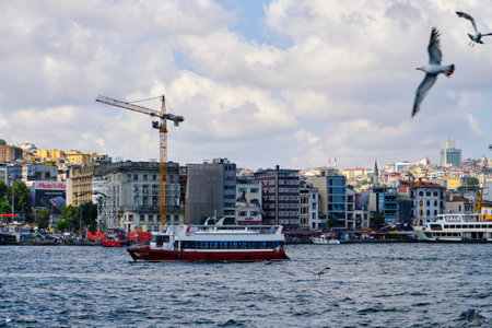 Istanbul, Turkey, July 14, 2021, Karakoy port, view of the city. Passenger ships and boats on the Bosphorus, people walk to the pierのeditorial素材