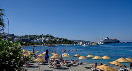 Boats and yachts on the pier. Tourists walk along the embankment of the resort town of Bodrum. Bodrum Turkey July 12, 2022. View of Marinaの写真素材