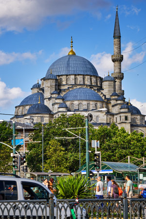 Istanbul, Turkey - July 18, 2022, Eminony pier, view of the Suleimania mosque. People stand at a stop and wait for a tramのeditorial素材