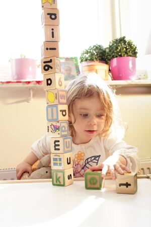 Playing with wooden blocksの写真素材