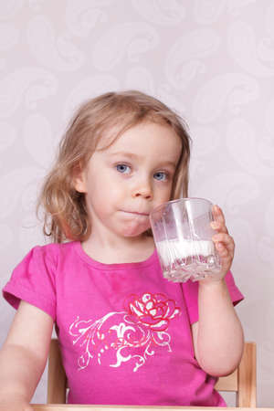 Young girl drinking milkの写真素材