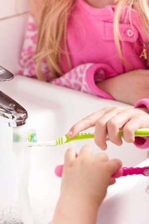 Girls brushing their teethの写真素材