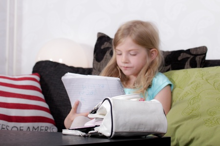 Girl doing homeworkの写真素材