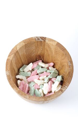 Candy in a wooden bowlの写真素材