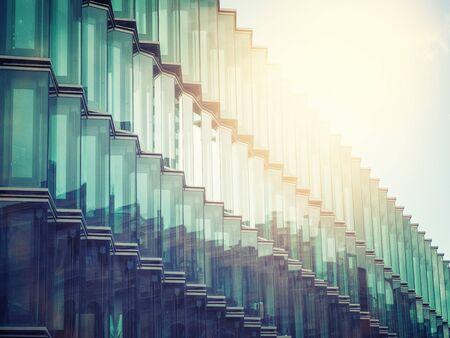 glass facade with yellow sunlight