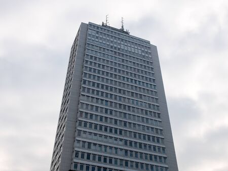Low Angle Architectural Exterior View of Highrise Office Skyscraper Building with Generic Facade and...