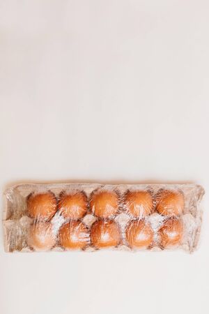 eggs isolated on white background.Food supplies crisis food stock for quarantine isolation period on white.Food delivery, Donation, coronavirus.Tape measure.の写真素材