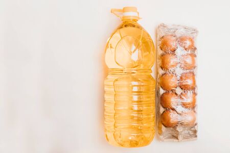 vegetable oil, eggs isolated on white background.Food supplies crisis food stock for quarantine isolation period on white.Food delivery, Donation, coronavirus.Tape measure.の写真素材