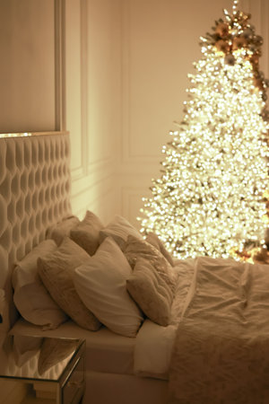 Christmas decorations lights. Modern New Year's decor. Christmas trees with garlands and gifts. Winter holidays. High quality photoの写真素材