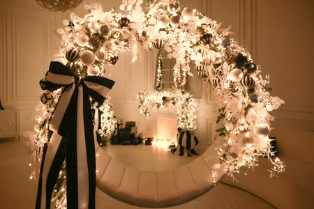 Christmas decorations lights. Modern New Years decor. Christmas trees with garlands and gifts.の写真素材