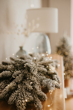 Christmas decorations lights. Modern New Years decor. Christmas trees with garlands and gifts.の写真素材