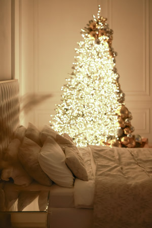 Christmas decorations lights. Modern New Years decor. Christmas trees with garlands and gifts.の写真素材