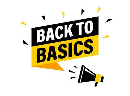 Male Hand Holding Megaphone With Back To Basics Speech Bubble
