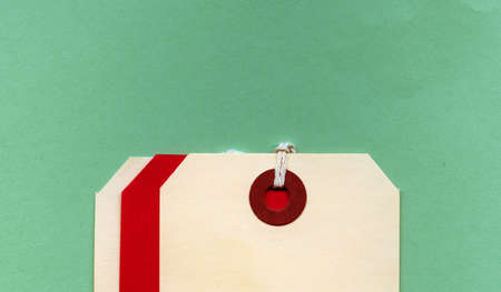 Cream and Red Tags on Green Field