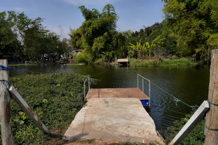 Rope powered ferry platform to a river island. Buriram, Thailand.の写真素材
