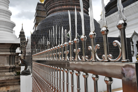 Chrome railing crowned with assorted blades, Wat Ban Den. Chiang Mai province, Thailand.の写真素材