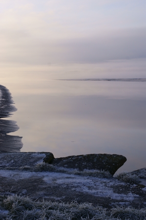 A cold, icy and misty scene on the River Nith at Glencaple, Dumfries, Scotlandの写真素材