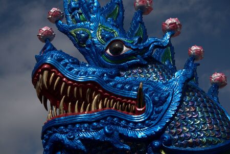Blue Dragon temple Guardian with gold teeth. Wat Ban Den, Chiang Mai, Thailandの写真素材