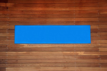 blank blue sign with a copy space area on brown boardsの写真素材