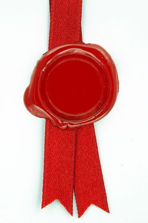 round red wax seal on a red ribbonの写真素材