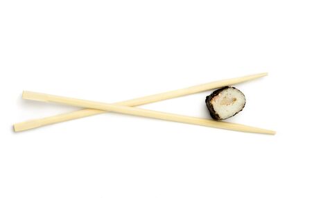 An images of sushi roll with japanese sticksの写真素材