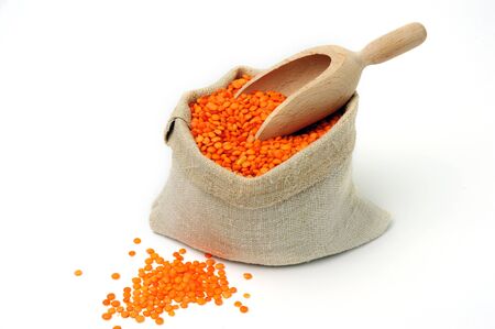 An image of orange lentils in a textile bagの写真素材