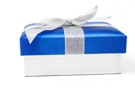 An image of blue gift box with silwer bow on white backgroundの写真素材