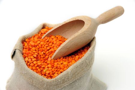An image of orange lentils in a textile sackの写真素材