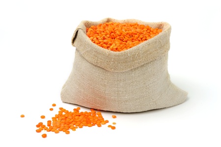 An image of orange lentils in a textile sackの写真素材