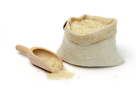 An image of raw rice in a burlap bagの写真素材
