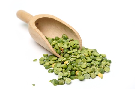 An image of green peas in a scoopの写真素材