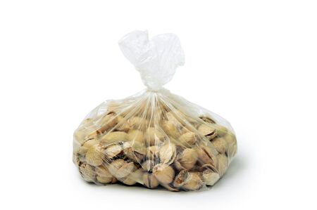An image of pistachios in a transparent bagの写真素材