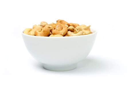 An image of tasty cashew nuts in a bowlの写真素材