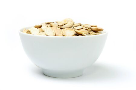 An image of a bowl with pumpkin seedsの写真素材