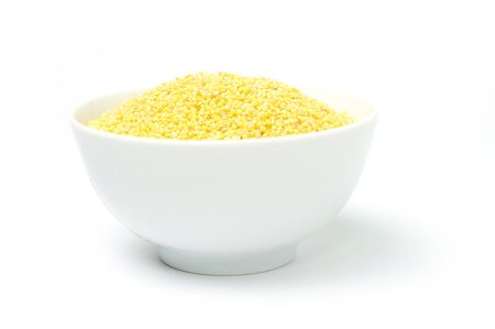 An image of yellow millets in a bowlの写真素材