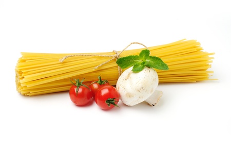 An image of yellow spaghetti with ingridients on whiteの写真素材