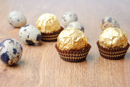 An image of eggs and candies on the tableの写真素材
