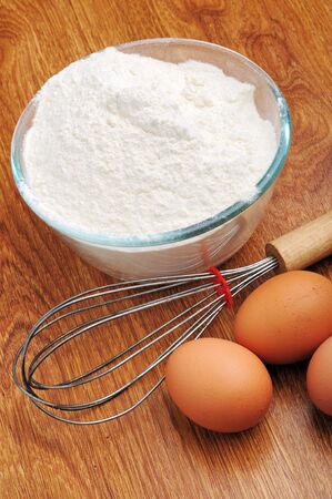 An image of three eggs on a wooden tableの写真素材