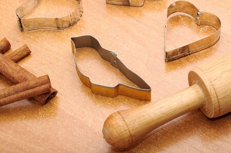 Forms for cookies on wooden tableの写真素材