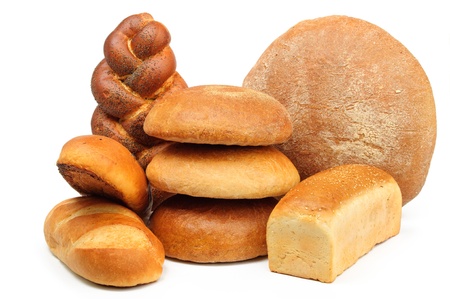 assortment of baked bread on white tableの写真素材