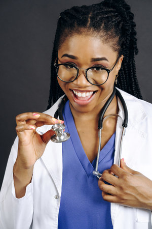 young pretty african american woman doctor with stethoscope, healthcare people conceptの写真素材