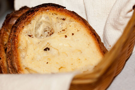 Handmade sliced bread in a basketの写真素材