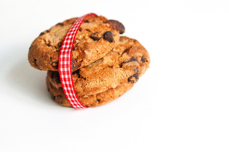 Cookies on white with ribbon in red whiteの写真素材