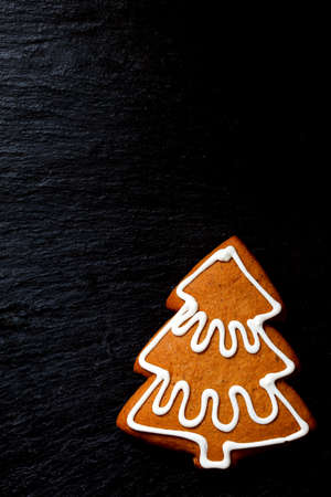 Gingerbread Christmas tree on black with space for textの写真素材