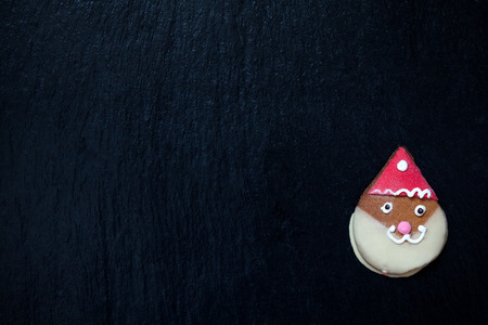 Gingerbread Santa Claus on black with space for textの写真素材
