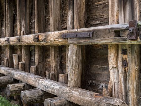 Old faded scratched beams of a historic building with rusty steel elementsの写真素材
