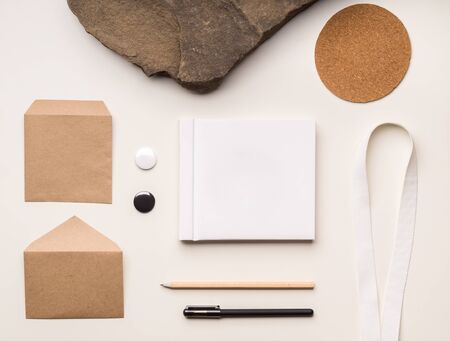 Branding template with craft paper envelopes and office stationeryの写真素材