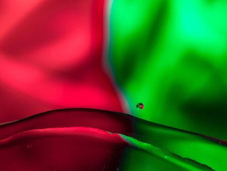 Colourful surreal psychedelic abstract liquid background. Water and oil drops with small air bubbles